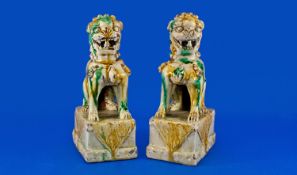 Chinese Ming Dynasty Pair of Foo Dogs, 17th/18th Century, each with mouth agape and baring teeth,