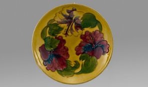 William Moorcroft Signed Footed Bowl Early `Hibiscus` Design on yellow ground. Circa 1940`s. 2`` in