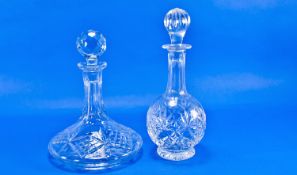 Cut Glass Ships Decanter and a further cut glass regular wine decanter, both with stoppers, (2).