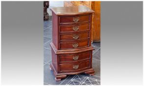 Small Mahogany Chest of Drawers, of bow fronted form, the upper section fitted with four drawers,