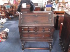 Early 20th Century Oak Carolean Bureau, the fall and drawer fronts with geometrically applied