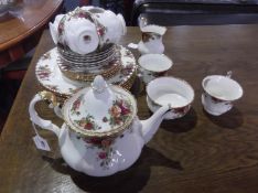 Royal Albert `Old Country` Roses Part Tea Set, comprising teapot (A.F), six cups, saucers and side