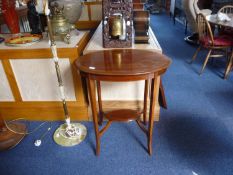 Edwardian Mahogany Occasional Table, of oval two-tier form, inlaid with boxwood stringing to top,