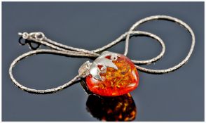 Silver Mounted Amber Pendant And Chain.