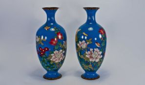Late 19th Century Pair of Japanese Cloisonne Enamel Vases. Floral and bird decoration on blue
