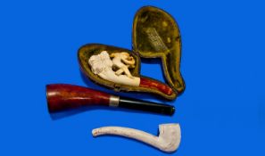 Carved Meerschaum Pipe With Amber Mouthpiece, In Fitted Case. Together With A Clay Pipe And A