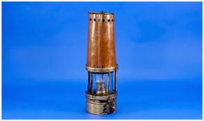 Early 20th Century Brass and Copper Miner`s Lamp, 10 inches high.