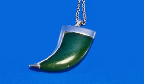 A Dark Green Nephrite Jade and Silver Scimitar Shaped Pendant on a Silver Chain. Both pendant and