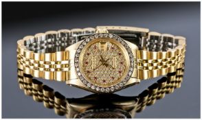 Rolex 18ct Gold Ladies Datejust Wristwatch. With diamond bezel. The dial pave set with diamonds &