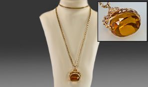 A 1930`s 9ct Gold Swivel Fob, Citrine supported on a fancy 9ct gold chain. Chain length 26``.