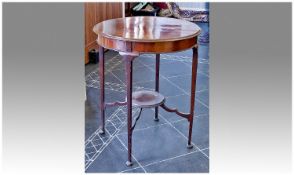 Edwardian Mahogany Two Tier Occasional Table, of circular form, measuring 30 inches high and 25