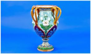 Minton Majolica Four Handled Vase, the body of goblet shape on a low, knopped circular spread foot;