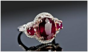 14ct White Gold Diamond & Ruby Ring, Central Oval Cut Ruby, (Approx 7.50cts) Set Between Two Round