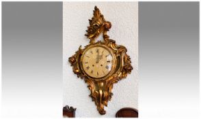 Regency Style Carved Gilt Wood Wall Clock. With 8 day striking movement. 8 inch dial, 29 inches