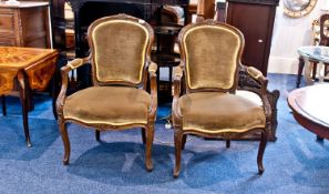 A Pair of French Arm Chairs with Open Arms and Carved Cabriole Legs. Carved to the Backs with