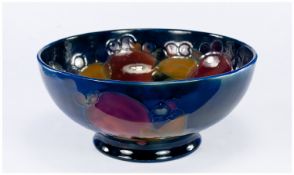 William Moorcroft signed Footed Bowl. ``Pomegranate`` design. c.1930`s. 4.25 inches high, 9.25