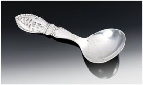 A Danish Silver Caddy Spoon. The handle with a depiction of the town of Helliggeist Naestved. Oval