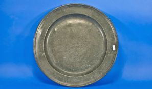 English Pewter Charger, probably 18th century, with moulded rim to edge and concave recessed