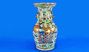 An Unusual Cantonese Celadon Ground Decorated Vase. The body decorated in famille rose pallete with