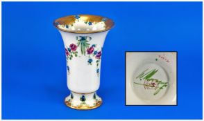 William Moorcroft Signed Macintyre Trumpet Vase decorated with rose garland design on white ground.