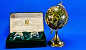 Boxed Set of 2 German Crystal Brandy Glasses together with a decorative globe.
