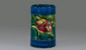 Moorcroft Rare Cylindrical Shaped Small Vase. ``Orchid design`` on blue green ground. Marks to the