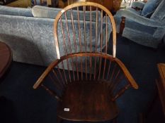 Elm Windsor Chair, probably 19th century, fitted with turned spindles, with arm supports, stamped `
