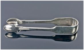 Pair of Silver Sugar Tongs, hallmarked for London 1873, inscribed cipher to end,