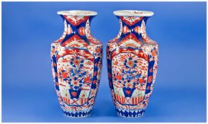 Pair of Japanese Satsuma Imari Patterned Vases, 20th century, each measuring 12 inches high.