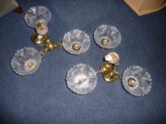 Two Pairs of Three Branch Ceiling Lights, with flared moulded and partially frosted glass shades,