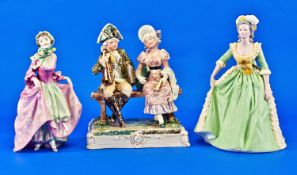 Royal Dux/ Eichler Majolica Figure Group, young couple in 18th century dress seated on a wooden