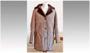 Taupe Sheepskin Suede Long Jacket with dark brown fur reverse forming the collar and inner, the