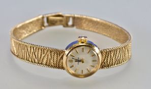 Omega Nine Carat Gold Vintage Manual Wind Ladies Wristwatch with 9 carat gold integral bracelet.