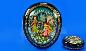 A Fine Quality Russian ``Papier - Mache`` Oval Shaped Box. Painted to the front with 3 figures in