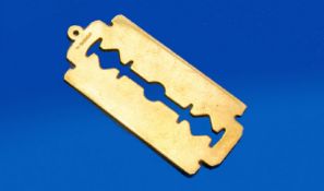 An Unusual Novelty 9ct Gold Pendant. Realistically designed as a razor blade (note: it`s not