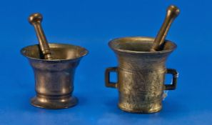 Two Various Brass Pestles and Mortars, each of campanula shape, one having two squared handles, the