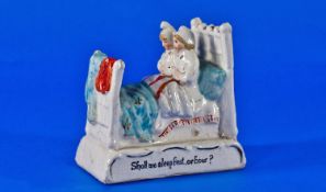 German Fairing Figure with inscription that reads `Shall we Sleep First or How?`. 4 by 3.5 inches