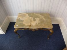 Onyx Topped Coffee Table, raised on a gilt frame with cabriole legs, 17 inches high, 28 wide and 18