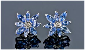 Tanzanite and Diamond Stud Earrings, each earring having eight marquise cut tanzanites surrounding