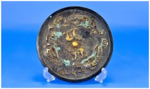 Oriental Style Metal Plaque/Mirror. Central Raised Animals With Figures, Moulded Edge. Diameter 6¼