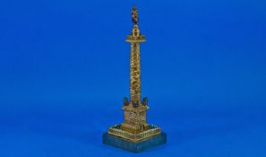 Brass Model of Napoleon`s Column, raised on a slate base, 10½ inches high.