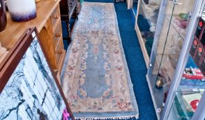 Woolen Runner Rug, floral decoration on a blue ground.