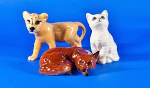 Beswick Figures. 3 in total. 1). ``Fox curled``, model no.1017, 4 inches wide. 2). ``Lion cub``,
