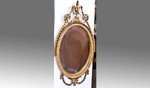 Adam Style Gilt Framed Wall Mirror, of oval form, the pediment with acanthus swag decoration,
