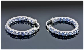 Tanzanite Hoop Earrings, a row of tanzanites down the front of each hoop and a further row down the