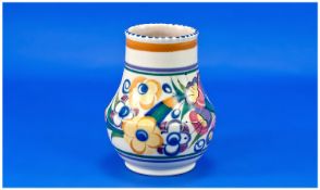 Poole Pottery Vase, of baluster form, hand painted with floral scenes, measuring 6 inches high,
