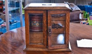 A Small Oak Edwardian Smokers Cabinet, with Fitted Drawers Enclosed with 2 Bevelled Glass Doors and