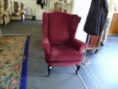 Traditional Red Upholstered Wing Chair, raised on cabriole legs to front, 40 inches high, 32 wide