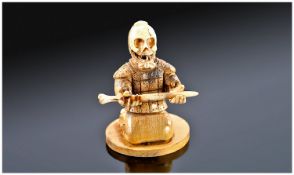 Modern Ivory Coloured and Wooden Skeleton Samurai Netsuke.