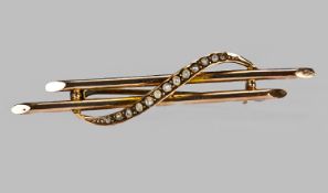 A 9ct Gold Twin Bar and Scroll Brooch set with seed pearls. Hallmarked for Chester 1913 by Tand G.